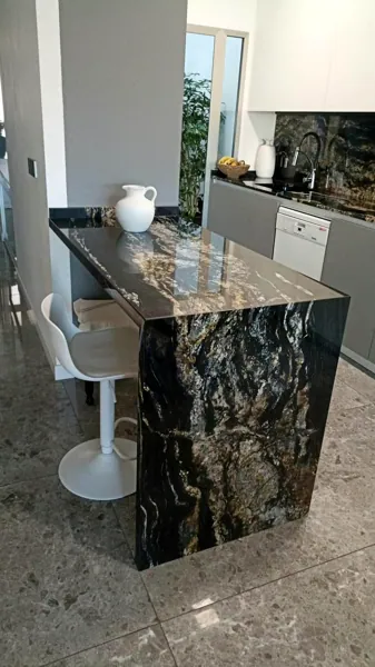 Kitchen in black stone with golden veins