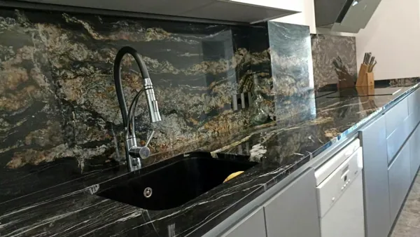 Kitchen in black stone with golden veins